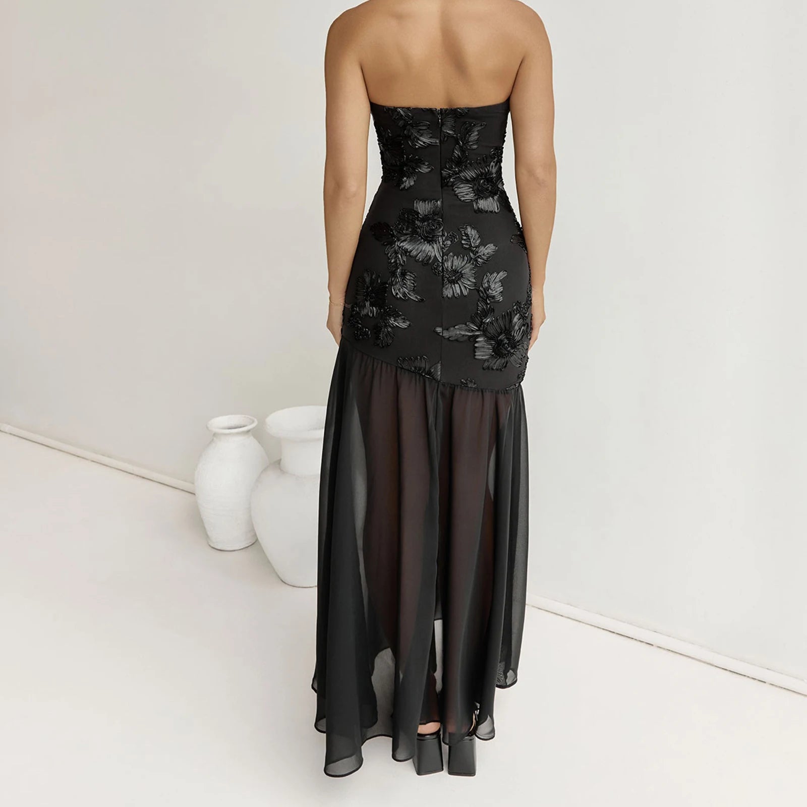 Black strapless dress with floral embroidery - back view
