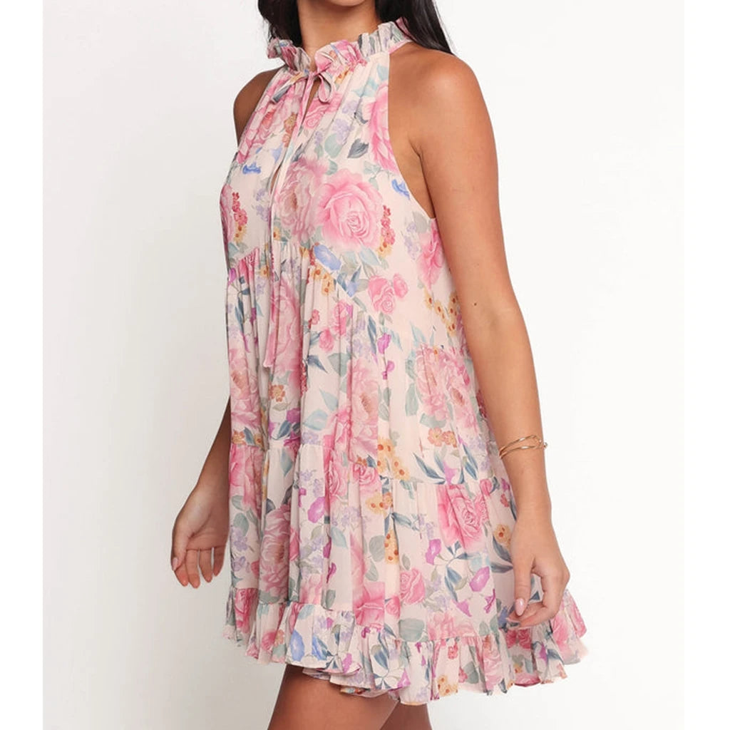 Woman wearing a floral dress - side view