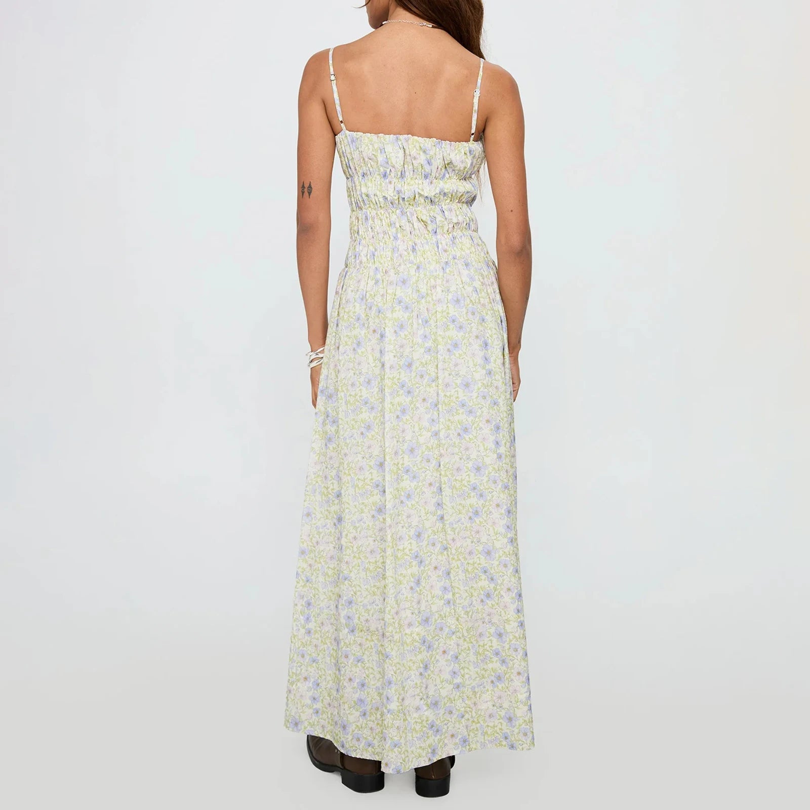 Woman wearing a floral dress - back view