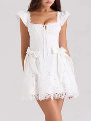 Women's white solid mini dress with a corset-style bodice, ruffled straps, and an A-line skirt.