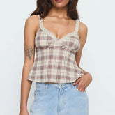 Woman wearing a plaid top and jeans