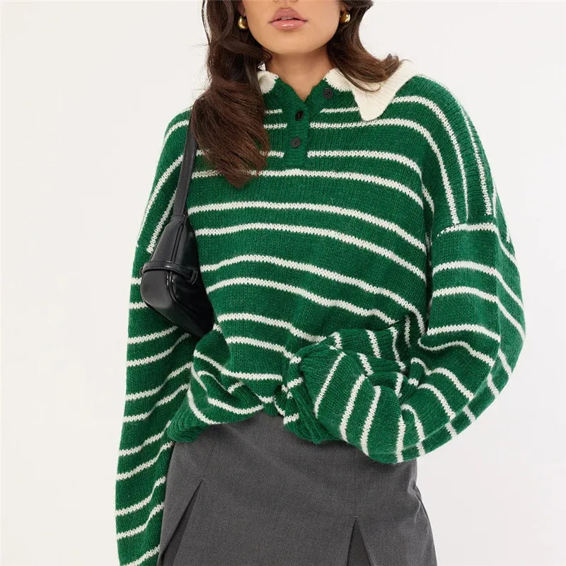 Person wearing a green and white striped sweater with a black bag on a white background