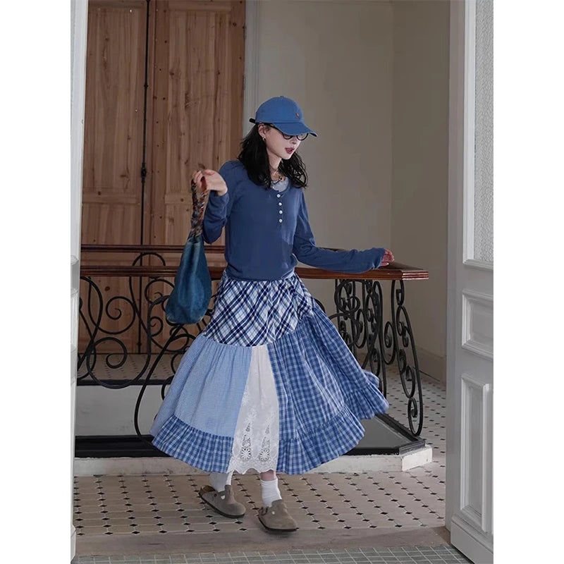 Women's plaid patchwork midi skirt with lace decoration and A-line silhouette.
