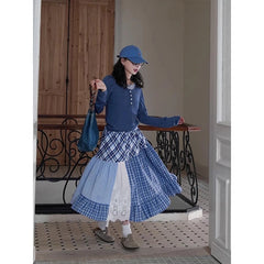 Women's plaid patchwork midi skirt with lace decoration and A-line silhouette.