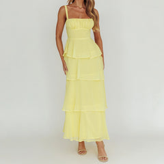 Woman wearing a yellow tiered dress