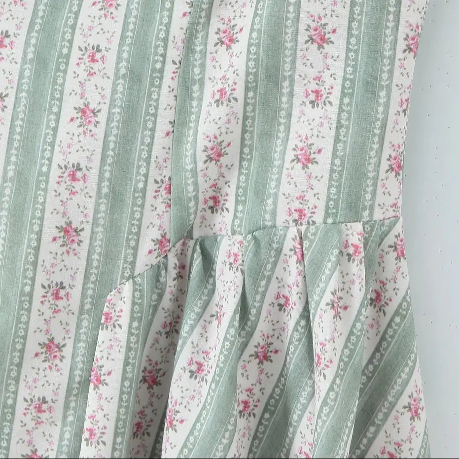 Women's green striped floral print corset style midi dress with slash neck.