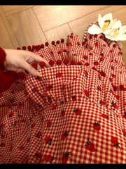 Women's red strawberry print tassel long skirt with tiered ruffles.