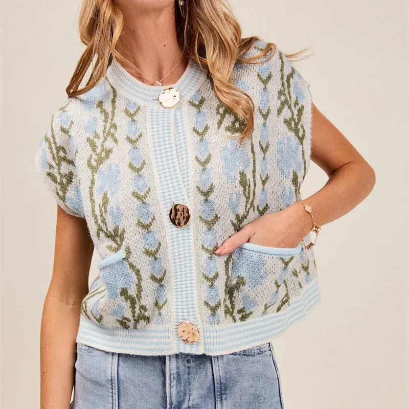 Woman wearing a floral patterned cardigan on a beige background