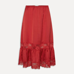 Red skirt with lace details on a light gray background