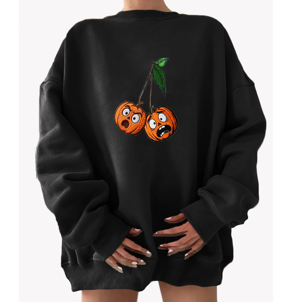 Black sweatshirt with cartoonish pumpkins on the back