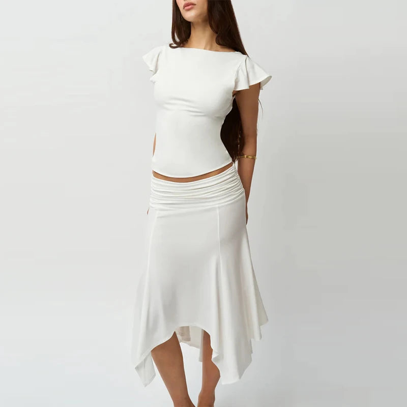 White dress with ruffled sleeves on a plain background