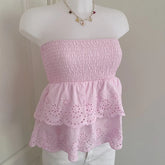 Pink eyelet ruched tube top for women.
