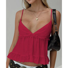 Woman wearing a red dress with a plain background