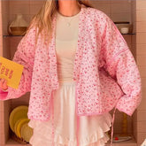 Women's pink printed knit cardigan with covered buttons for autumn and winter.