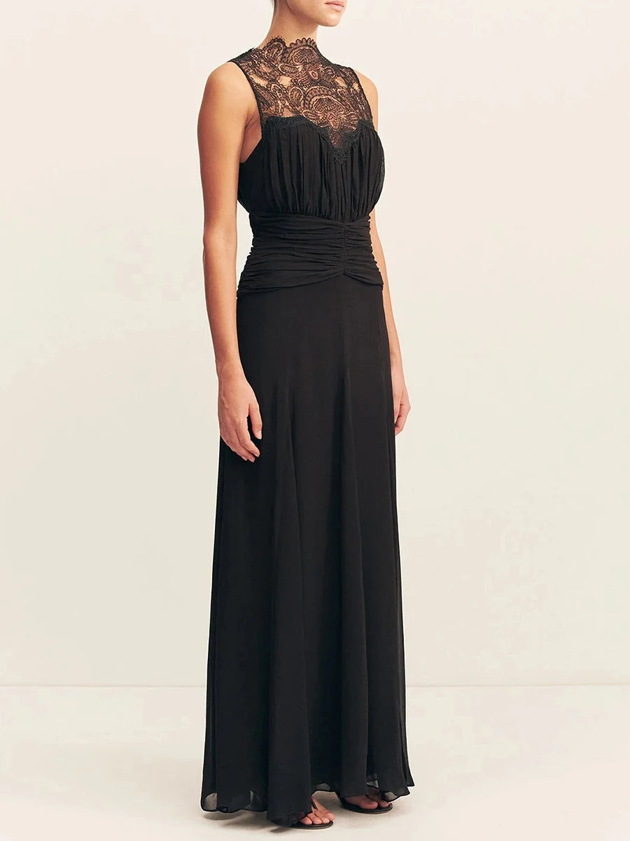 Black evening gown with lace detailing on a white background