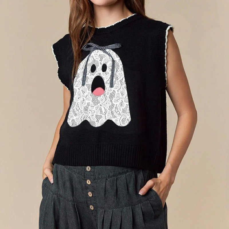 Black sleeveless sweater with a white ghost design on a beige background