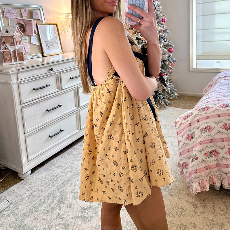 Women's tie-up ruffle print babydoll mini dress with square collar.