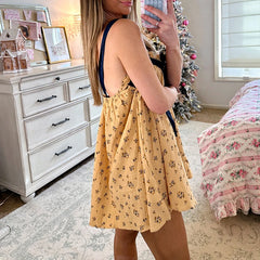 Women's tie-up ruffle print babydoll mini dress with square collar.