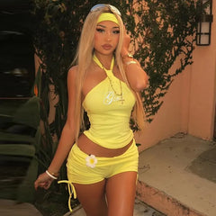 Women's halter rhinestone crop top and drawstring shorts co-ord set in yellow or black.