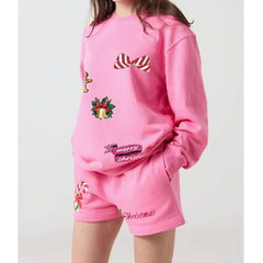 Pink Christmas-themed outfit with graphics