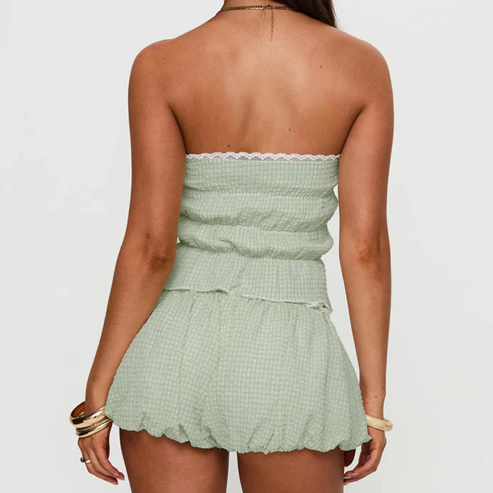Women's green bandeau tube top and matching plaid shorts set.