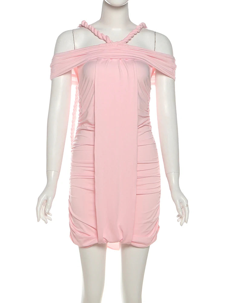 Pink dress on a mannequin against a white background