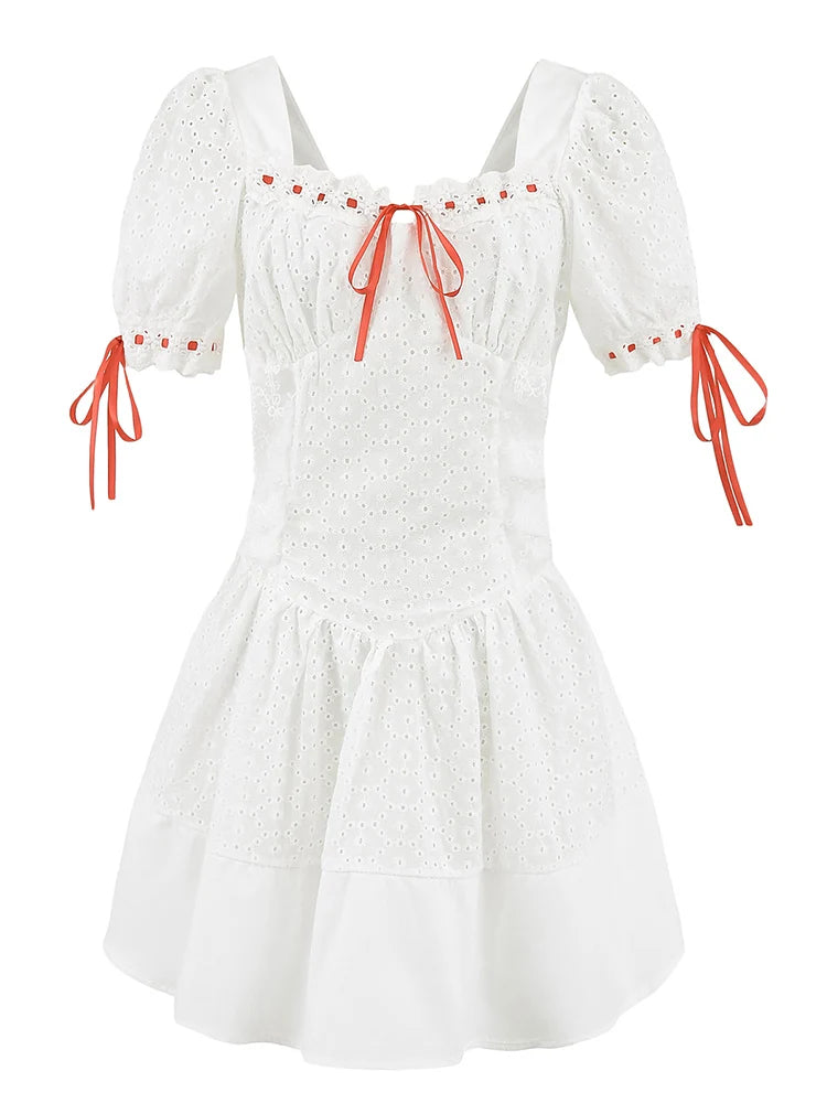 White dress with orange accents