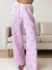 Women's pink striped high-waist lounge pants.