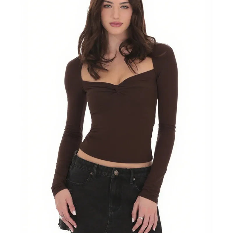 Woman wearing a brown long-sleeve top