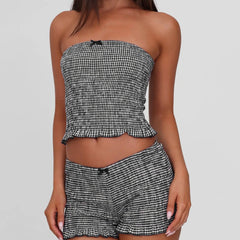 Women's black plaid smocked tube top and matching shorts set.
