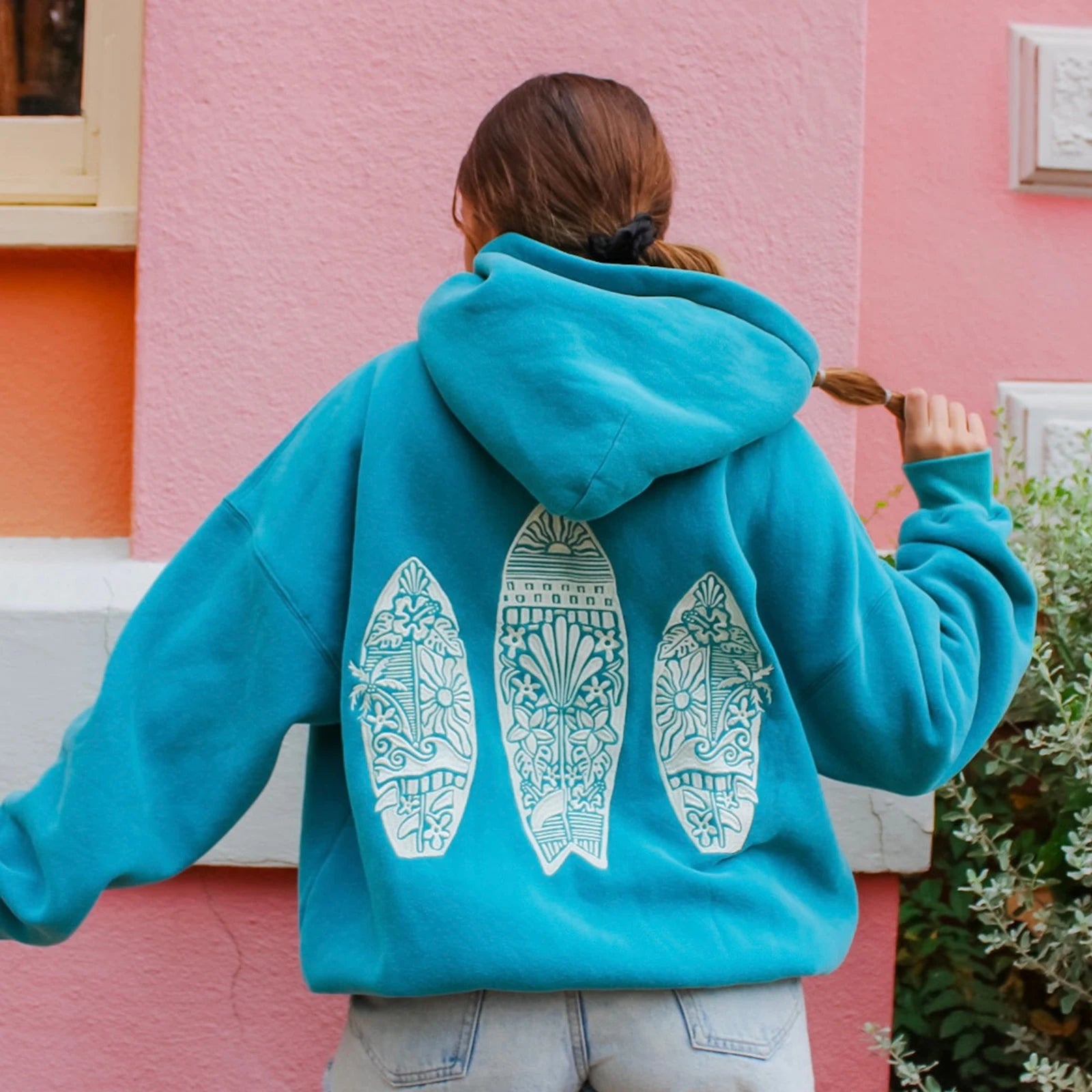Women's surf board embroidered hoodie in a loose fit.