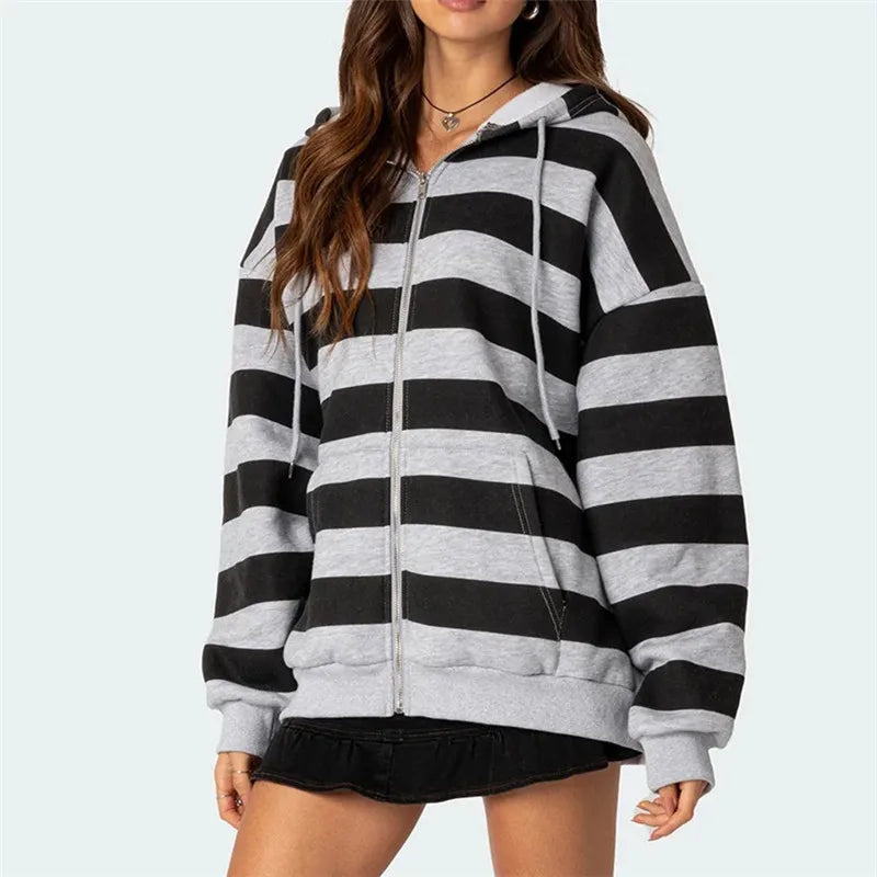 Black and gray striped hoodie worn by a person on a white background