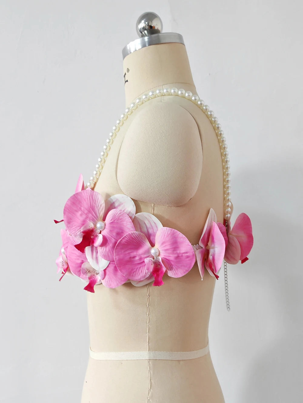 Women's pink 3D orchid pearl strap crop top.
