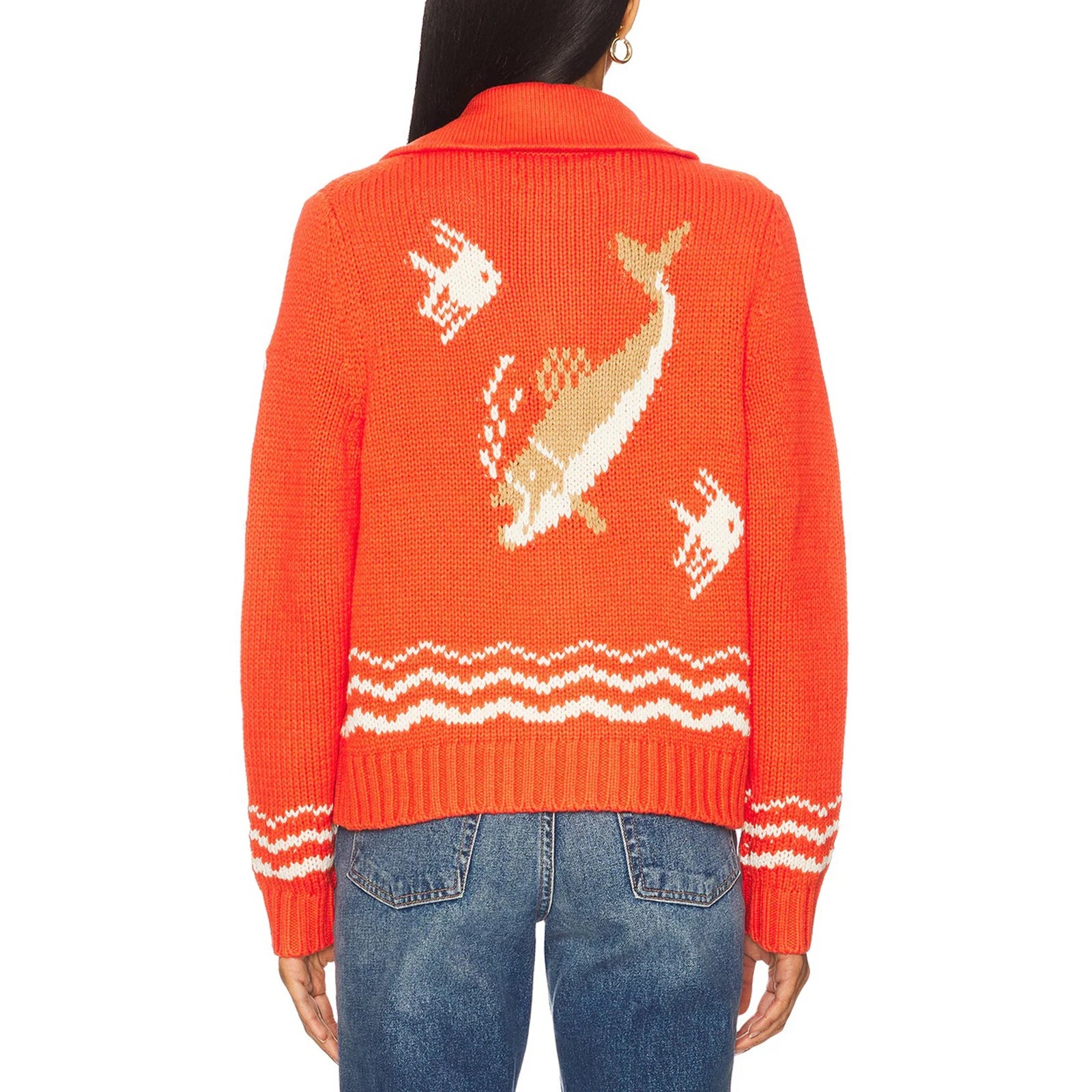 Person wearing an orange sweater with a deer design