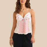 Woman wearing a floral top with a beige background