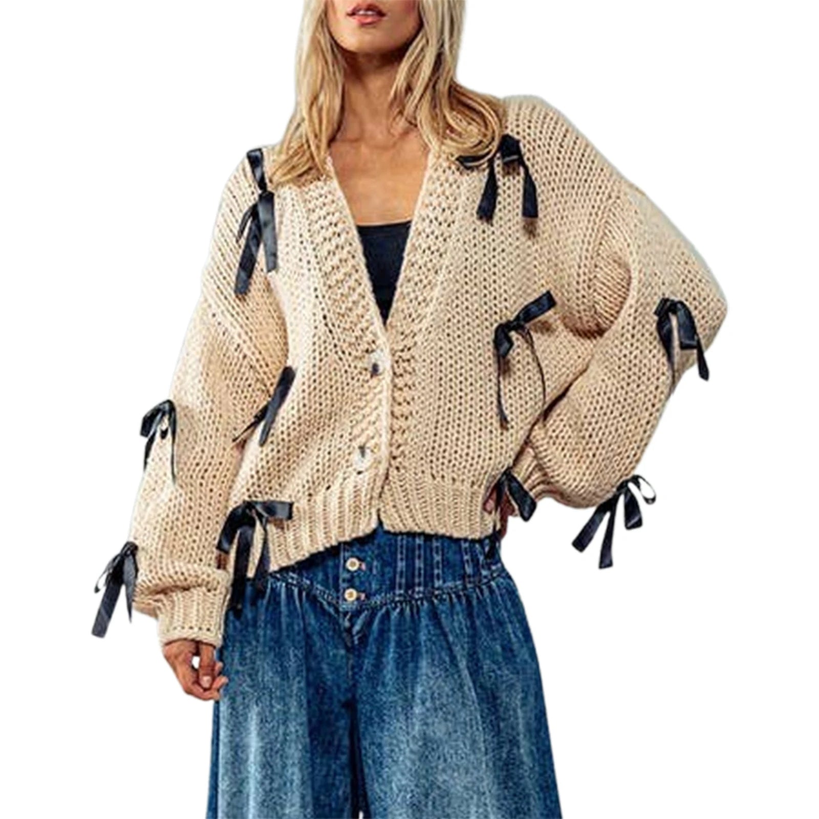Beige knitted cardigan with black ribbons worn by a model - front