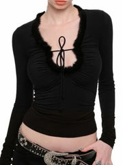 Black long-sleeve top with a unique neckline design
