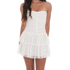 White strapless dress worn by a model - close-up view
