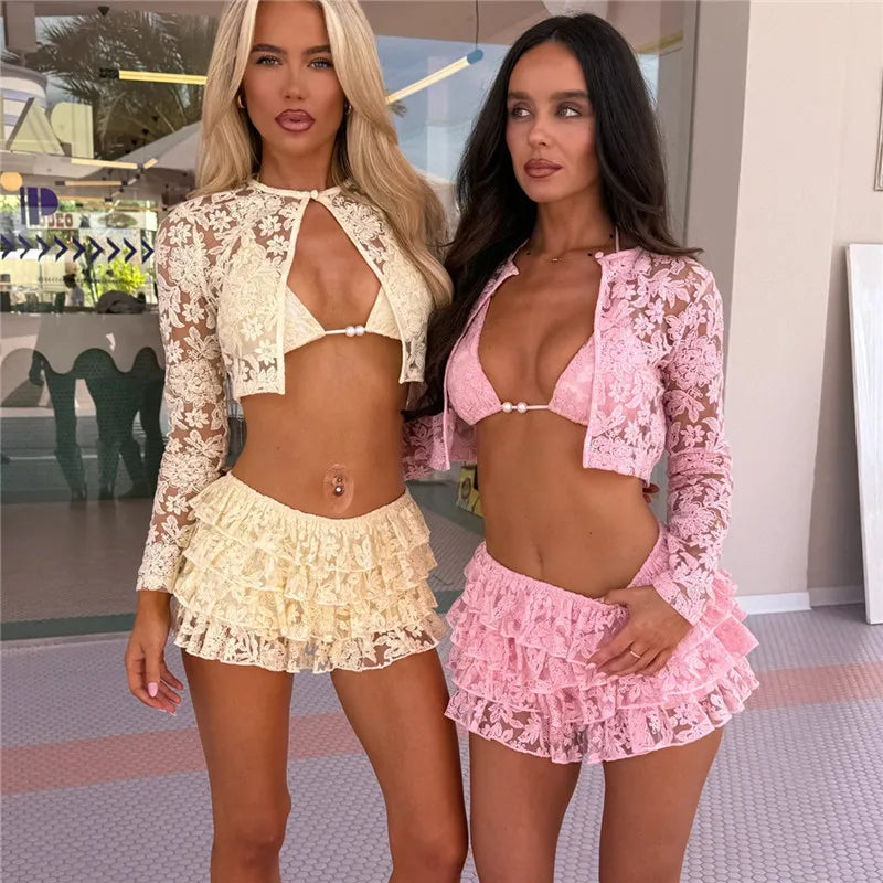 Two women wearing matching lace outfits in a casual setting.