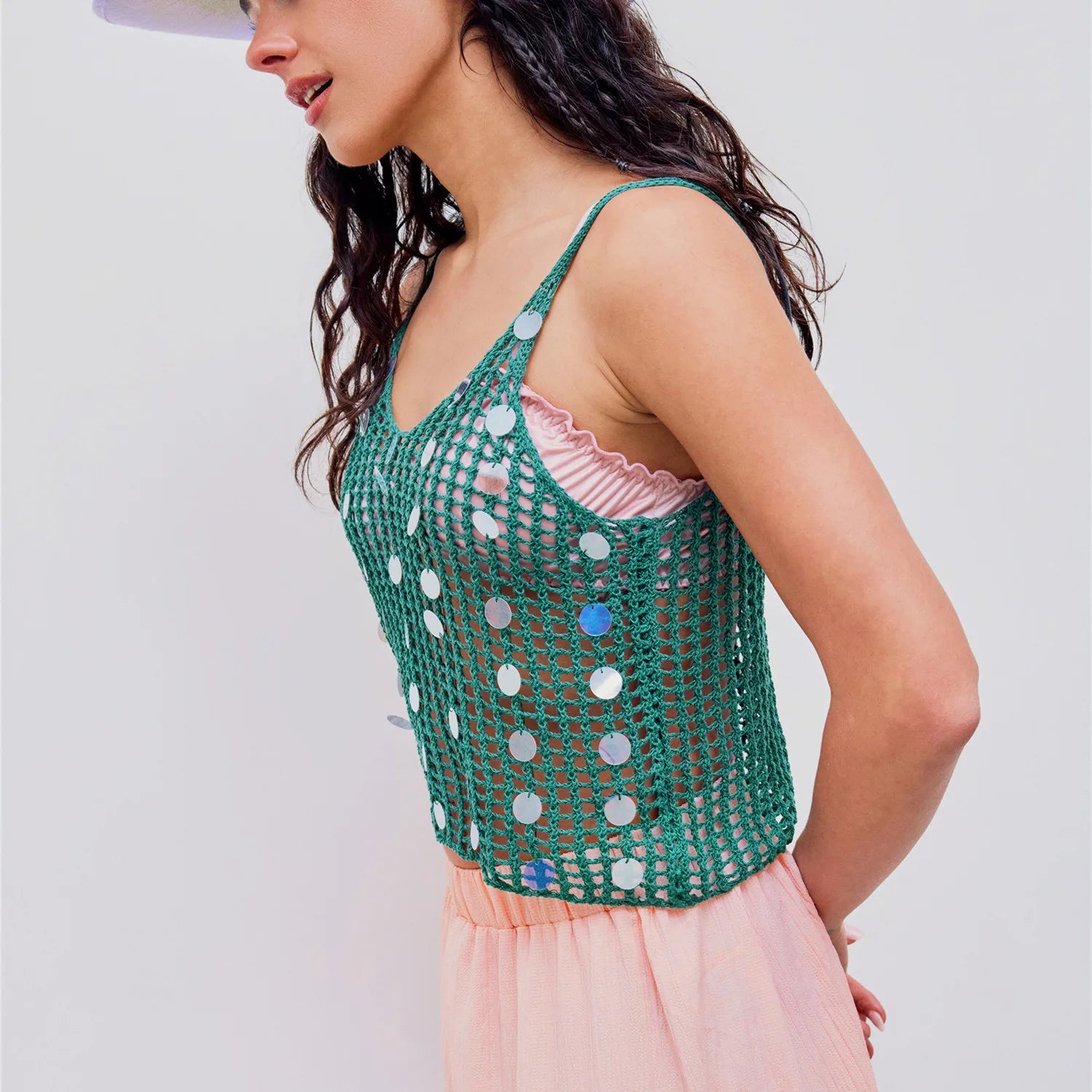 Women's green knit sequin tank top with a short length.