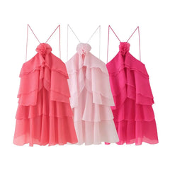 Three pink ruffled dresses