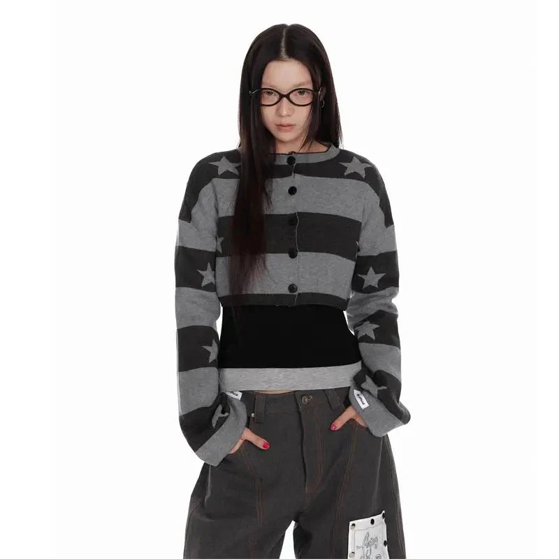 Person wearing a black and gray striped sweater with star patterns