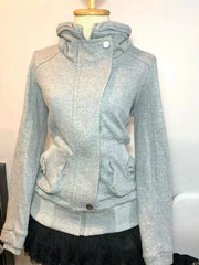 Gray hooded jacket on a mannequin against a white background