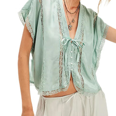 Light green lace-trimmed top worn by a person