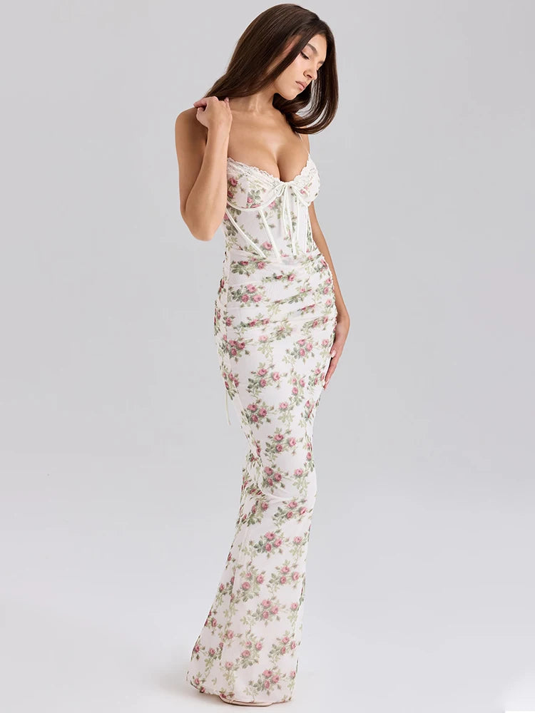 Woman wearing a floral strapless gown on a plain background
