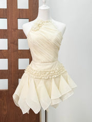 Beige dress on a mannequin against a white background