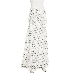 White skirt with black polka dots on a mannequin against a white background