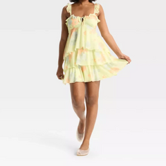 Woman wearing a yellow floral dress