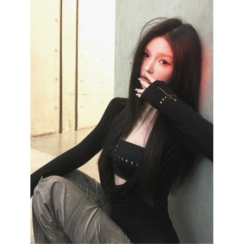 Women's black long sleeve cut out drape halter top with asymmetrical collar.