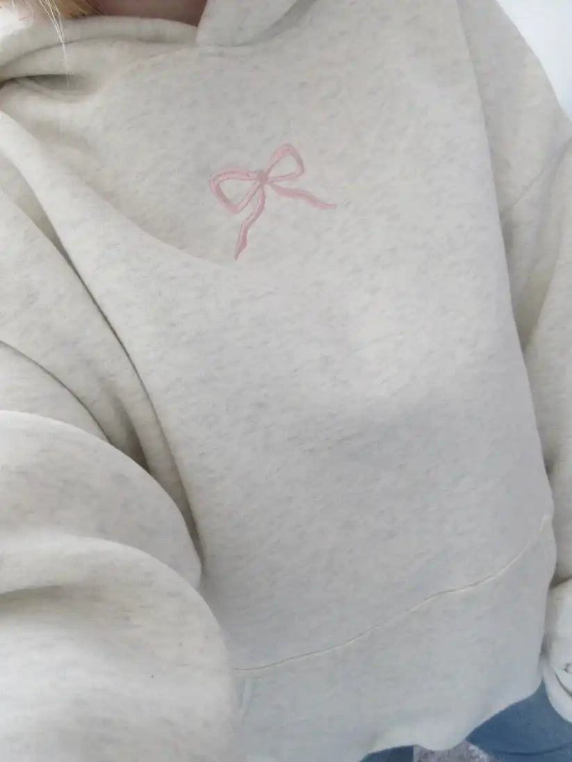 Women's bow embroidery hoodie in a loose fit.